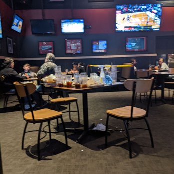 Buffalo Wild Wings - people sitting at tables in a restaurant - Chicken Wings Near Me - Fishers, Indiana