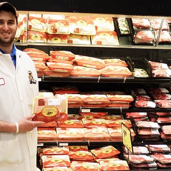 Buehler's Fresh Foods - a man standing in front of a display of meat - Grocery Near Me - Massillon, Ohio Buehler's Fresh Foods - a man standing in front of a display of meat - Grocery Near Me - Massillon, Ohio