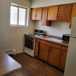 Harbor Motel - Kitchenette for your longer stay with Full Size Fridge and Stove and Cabinets.