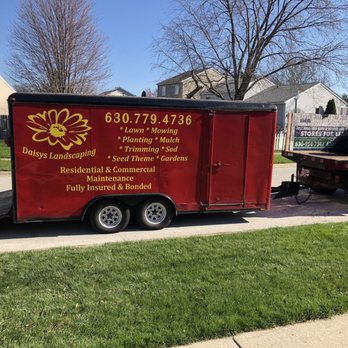 DAISY'S LANDSCAPING & SNOW - a truck with a trailer attached to it - Landscaping Near Me