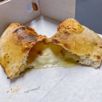 Pizzeria Cristian - Four cheese calzone to go - Pizza Near Me - Milan, Michigan Pizzeria Cristian - Four cheese calzone to go - Pizza Near Me - Milan, Michigan