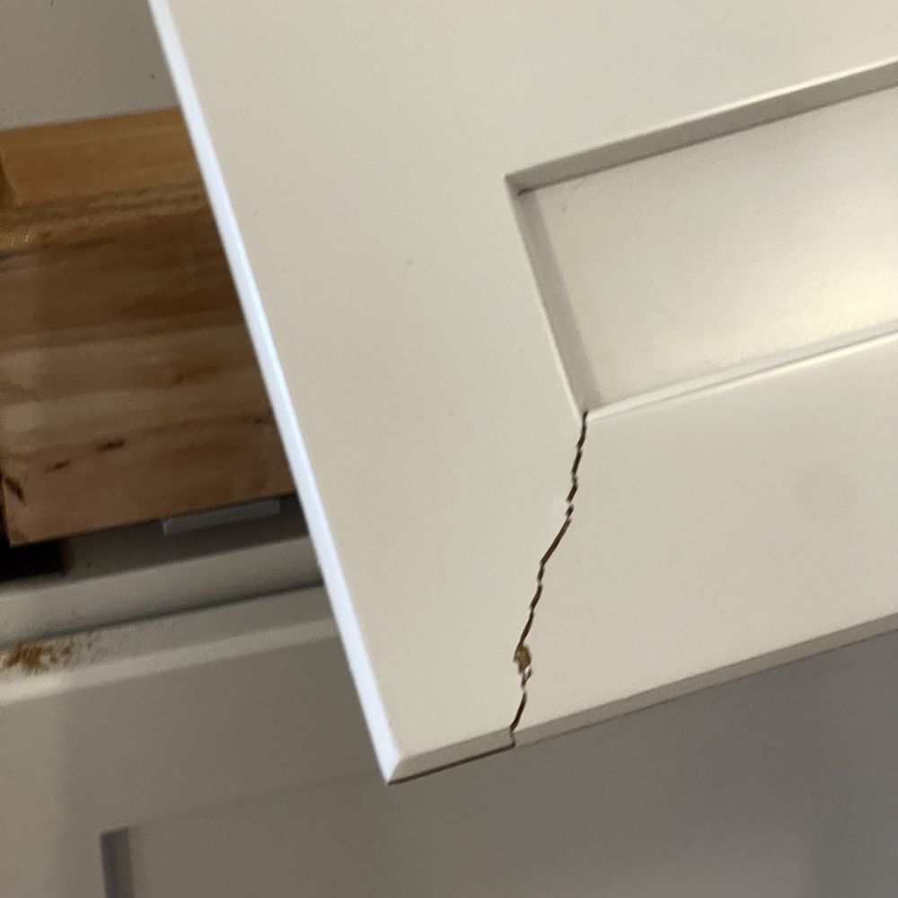 Cabinets To Go - a crack in the bottom of a cabinet - Kitchen & Bath Near Me - Braintree, Massachusetts
