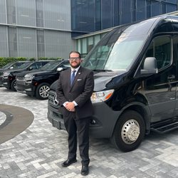 Jacksonville Black Car Limo Service - Jacksonville Chauffeur at downtown business with chauffeured sprinter van, limo sedan and black car SUV