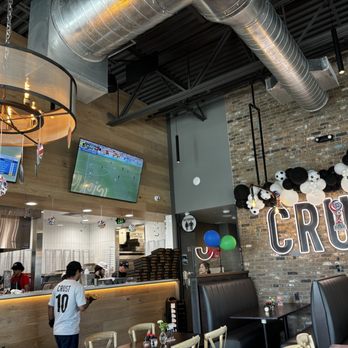 Crust Pizza - Celebrating FIFA soccer season !!! The owner changed the TV channel to watch Brazil vs. Marruecos! - Pizza Near Me - Katy, Texas