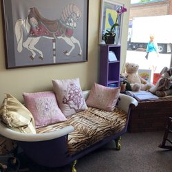Purple Crow Books - What acozy place to sit and look through the books