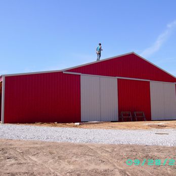Highlander Construction - a red building with a weather vane on top - General Contractors Near Me Highlander Construction - a red building with a weather vane on top - General Contractors Near Me