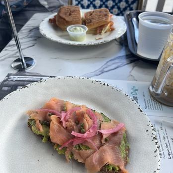 Brew It Cafe - Avocado toast with smoked salmon (front) and breakfast sandwich (back) - Breakfast & Brunch Near Me - Fort Lauderdale, Florida