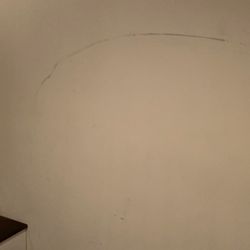 Scratched wall with dresser