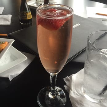 In the Raw Sushi - A special drink that Angel the bartender made. Strawberry infused champagne. It was just sweet enough! - Sushi Bars Near Me - Tulsa, Oklahoma In the Raw Sushi - A special drink that Angel the bartender made. Strawberry infused champagne. It was just sweet enough! - Sushi Bars Near Me - Tulsa, Oklahoma