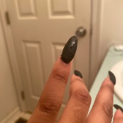 Kim's Nail Spa - Chipped, matte black acrylic nail polish