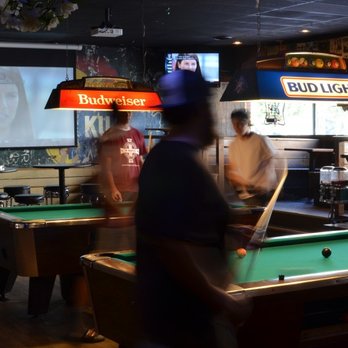The Bottleneck - people playing pool in a bar - Music Venues Near Me - Lawrence, Kansas