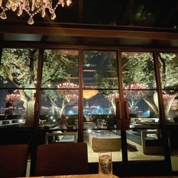 Outside view from our table with chandelier reflections and part of chandelier over our table Outside view from our table with chandelier reflections and part of chandelier over our table