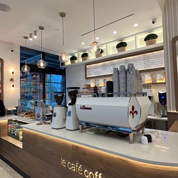 Le Café Coffee - a coffee shop counter with a coffee machine - Sandwiches Near Me - New York, New York Le Café Coffee - a coffee shop counter with a coffee machine - Sandwiches Near Me - New York, New York
