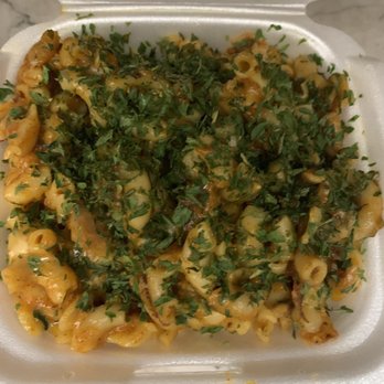 Eva's Jamaican Kitchen - Mac n cheese with spicy jerk chicken $3.50 . Delicious - Caribbean Near Me - Jacksonville, Florida Eva's Jamaican Kitchen - Mac n cheese with spicy jerk chicken $3.50 . Delicious - Caribbean Near Me - Jacksonville, Florida