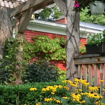 Michigan Landscape Design Services - a garden with yellow flowers - Landscaping Near Me - Plymouth, Michigan Michigan Landscape Design Services - a garden with yellow flowers - Landscaping Near Me - Plymouth, Michigan