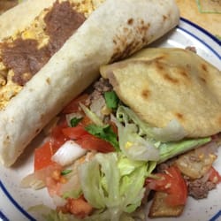 Chacho's Tacos - This is my chorizo con huevo taco with beans and a gordita with beans, carnita, and pico. I asked for them to add the lett & tom