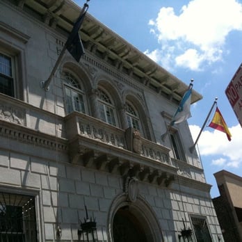 Casa Galicia - the front of a building with flags flying in the wind - Spanish Near Me - Astoria, New York Casa Galicia - the front of a building with flags flying in the wind - Spanish Near Me - Astoria, New York