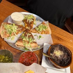 Marita's Cantina - Buffalo chicken quesadilla; with a side of black beans we ordered!