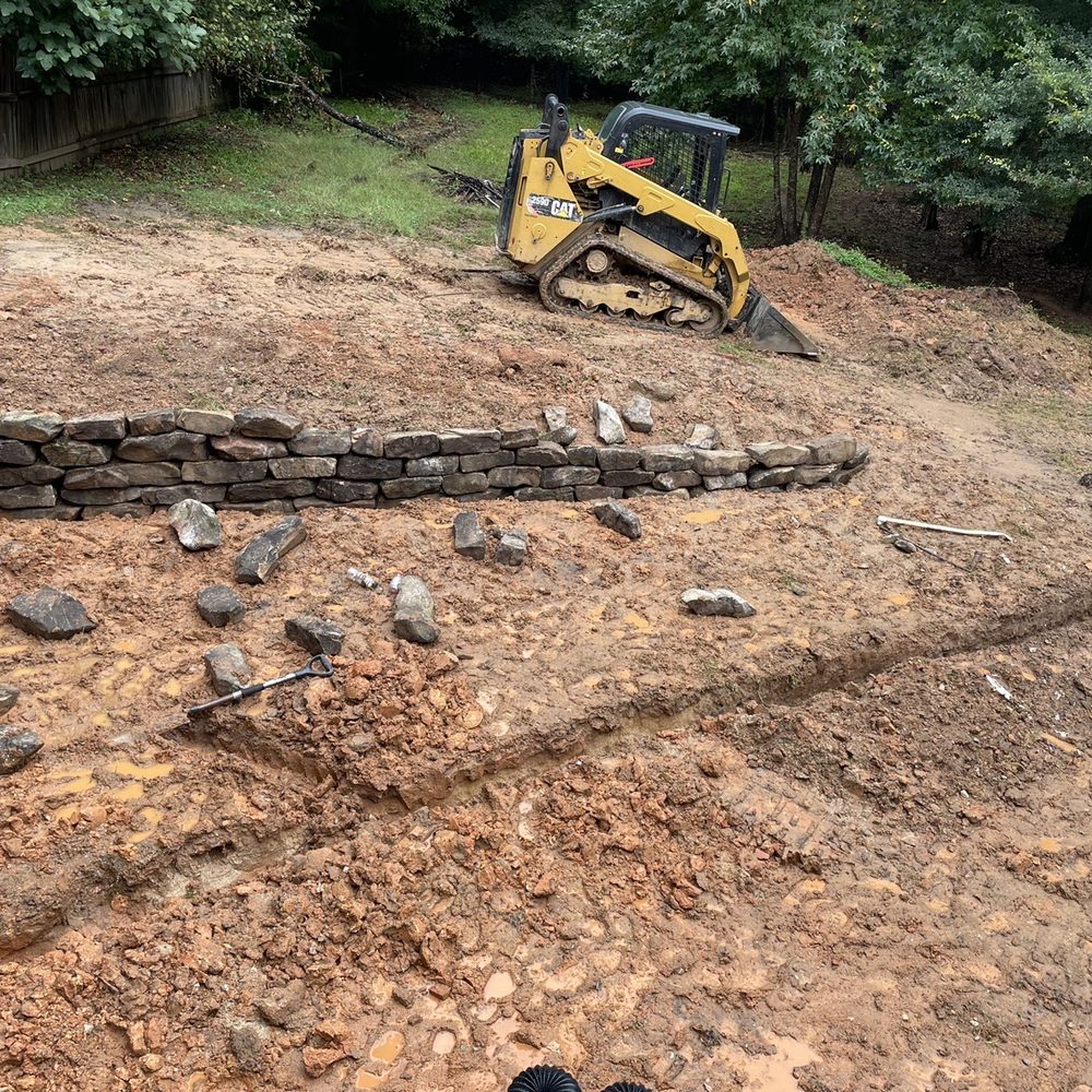 Semper Fi Lawn Care & Landscaping - Working on that retaining wall - Tree Services Near Me Semper Fi Lawn Care & Landscaping - Working on that retaining wall - Tree Services Near Me