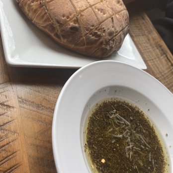 Skipolini’s Oakley - Skips dip, warm bread the evoo, Italian seasoning + parm and fresh garlic - Pizza Near Me - Oakley, California Skipolini’s Oakley - Skips dip, warm bread the evoo, Italian seasoning + parm and fresh garlic - Pizza Near Me - Oakley, California