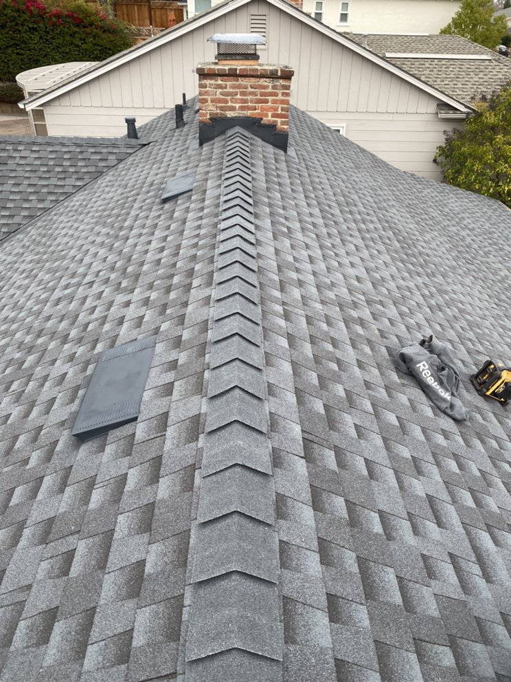 Slide of Mel's Roofing