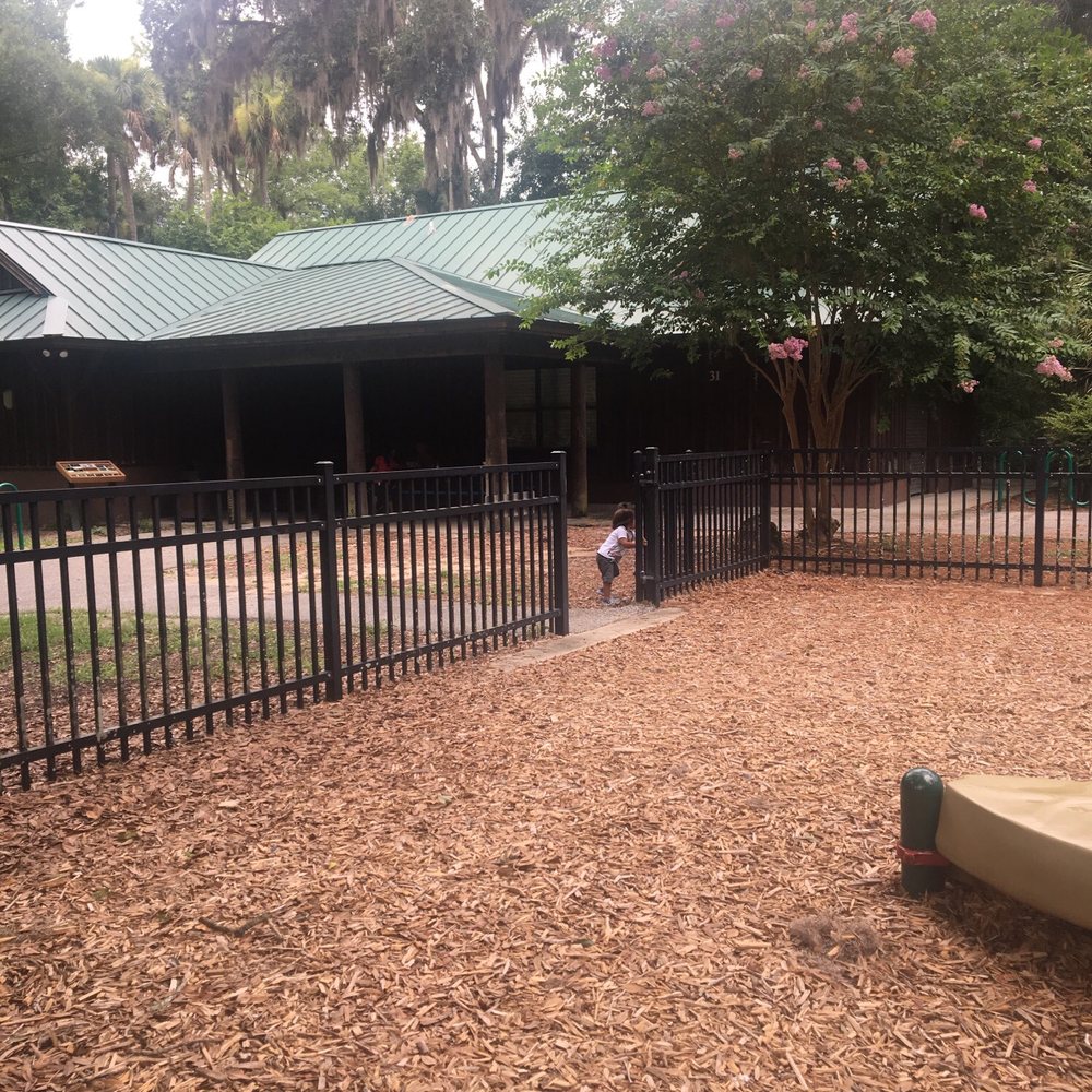 Palm Coast Linear Park - View of the covered patio and restroom area. - Parks Near Me - Palm Coast, Florida Palm Coast Linear Park - View of the covered patio and restroom area. - Parks Near Me - Palm Coast, Florida