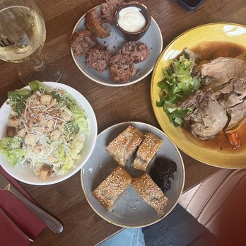 The Lamb - Delicious dinner! Pork belly roast, croquettes, Caesar salad and sausage roll - Pubs Near Me - London, XGL