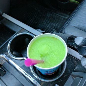 7-Eleven - a cup of green liquid in the center console of a car - Convenience Stores Near Me - Calgary, Alberta 7-Eleven - a cup of green liquid in the center console of a car - Convenience Stores Near Me - Calgary, Alberta