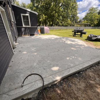 Skyroc Property Improvements - a concrete patio being built - Landscaping Near Me