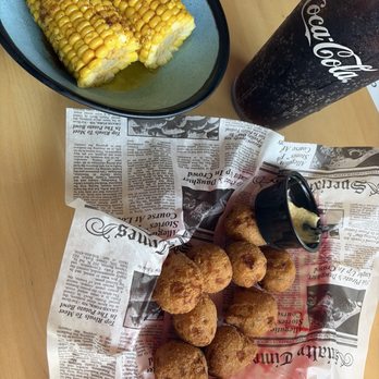 Catch 23 - Hush Puppy Basket and a side of Corn on the cob - Seafood Near Me - Folly Beach, South Carolina Catch 23 - Hush Puppy Basket and a side of Corn on the cob - Seafood Near Me - Folly Beach, South Carolina