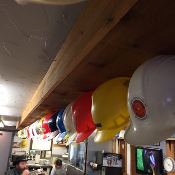 Hard Hat Restaurant - a row of hard hats hanging from the ceiling - American Near Me - Wooster, Ohio Hard Hat Restaurant - a row of hard hats hanging from the ceiling - American Near Me - Wooster, Ohio