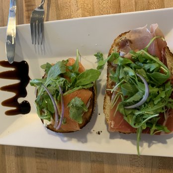 Gracious Bakery + Cafe - 1/2 Salmon Bagel on the left, 1/2 Prosciutto & Mozzarella Toast on the right - both were incredible! - Breakfast & Brunch Near Me - New Orleans, Louisiana Gracious Bakery + Cafe - 1/2 Salmon Bagel on the left, 1/2 Prosciutto & Mozzarella Toast on the right - both were incredible! - Breakfast & Brunch Near Me - New Orleans, Louisiana