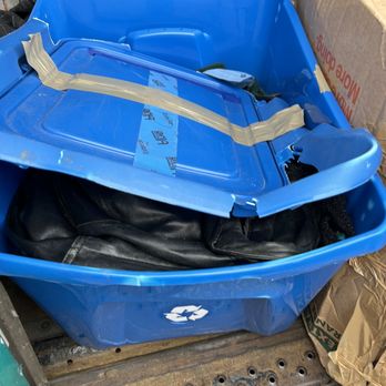 Clutter Moving & Storage - Completely crushed plastic storage container dislodged from the pile in the truck - Self Storage Near Me Clutter Moving & Storage - Completely crushed plastic storage container dislodged from the pile in the truck - Self Storage Near Me