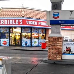 Chevron - So OPEN. Not a closed location. Address # above door. There's the storefront lights on customers inside. I'm here gassing up.