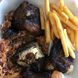 Wadadlys Island Flavors - Jerk Half-Chicken Dinner w/ Red Beans & Rice and French Fries. Amazingly charred, flavorful, juicy chicken with a nice bite to it.