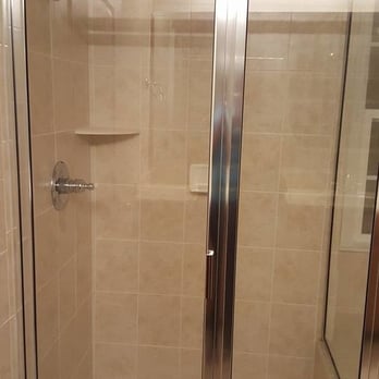 Ada's Miracle Cleaning - a shower with a glass door - Home Cleaning Near Me Ada's Miracle Cleaning - a shower with a glass door - Home Cleaning Near Me