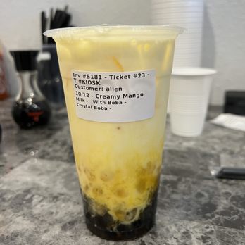 Happy Dumpling - a plastic cup filled with yellow liquid - Coffee & Tea Near Me - Denver, Colorado Happy Dumpling - a plastic cup filled with yellow liquid - Coffee & Tea Near Me - Denver, Colorado