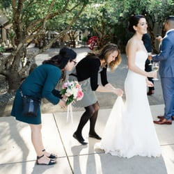 Sugar Rush Events - Kristen and Jovi of Sugar Rush bustling my wedding dress. They went above and beyond! Photo taken by Sarah Maren Photography.