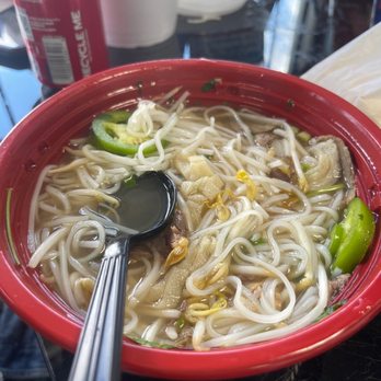 Pho Kobe - a bowl of noodles with a spoon in it - Asian Fusion Near Me - Victorville, California