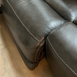 Walter E Smithe Furniture & Design - Armless leather recliner stuck in this position.