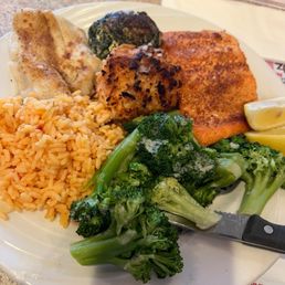 Seafood broil - stuffed shrimp, salmon, broccoli, rice, and flounder. Seafood broil - stuffed shrimp, salmon, broccoli, rice, and flounder.