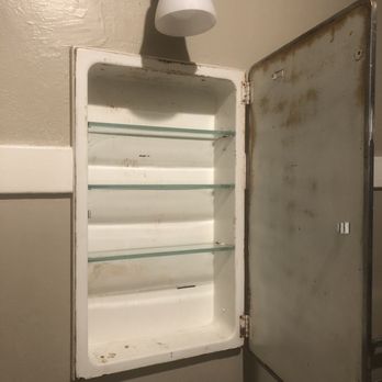 Buchanan Property Management - Rusted medicine cabinet, dirty and with a bad smell - Property Management Near Me - San Diego, California