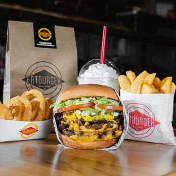 Fatburger - a burger and fries on a table - Burgers Near Me - Los Angeles, California Fatburger - a burger and fries on a table - Burgers Near Me - Los Angeles, California