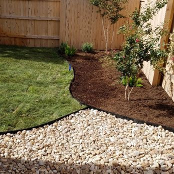 A + Sprinklers & Landscape - a garden with a fence and a gravel path - Landscaping Near Me - Austin, Texas A + Sprinklers & Landscape - a garden with a fence and a gravel path - Landscaping Near Me - Austin, Texas