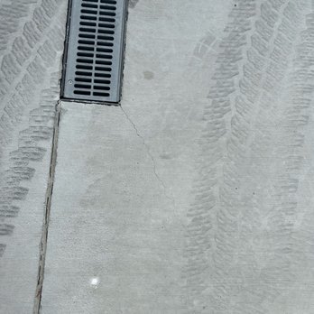 Sam The Concrete Man - Corner crack at French drain. - Masonry/Concrete Near Me - Pleasant Grove, Utah