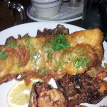 The Optimist - Fish and chips with hush-puppies beignet in the background - Seafood Near Me - Atlanta, Georgia The Optimist - Fish and chips with hush-puppies beignet in the background - Seafood Near Me - Atlanta, Georgia