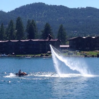 Far West Boat Tours - Yes, a kid hanging in the air, on a hover board!  It is propelled upwards by jets of water - Lakeside Marina, Flathead Lake, MT - Boat Tours Near Me - Lakeside, Montana