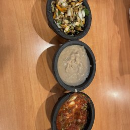 The 3 sides with the chips, regular salsa, doctored refried beans and the mushroom salsa. The 3 sides with the chips, regular salsa, doctored refried beans and the mushroom salsa.
