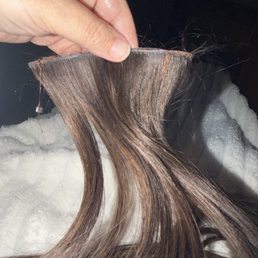 My hair extension that fell out, a week and a half after they were sewn in. My second row is falling out in the middle. My hair extension that fell out, a week and a half after they were sewn in. My second row is falling out in the middle.
