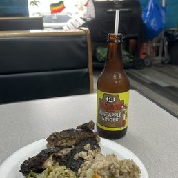 Small jerk chicken, peas & rice, cabbage.. pineapple ginger soda.